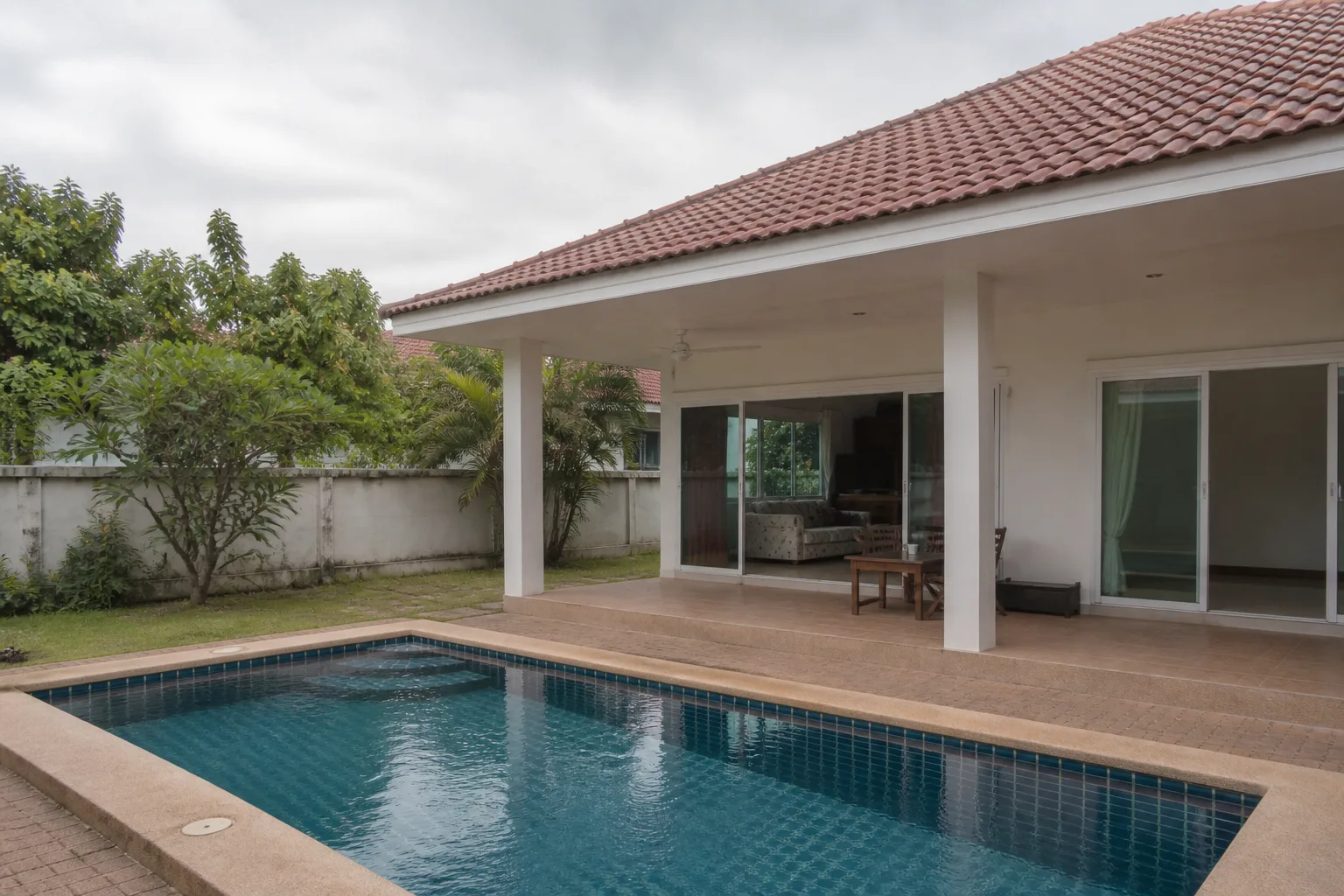 A single-storey three-bedroom pool villa on a walled plot in an inland Pattaya estate